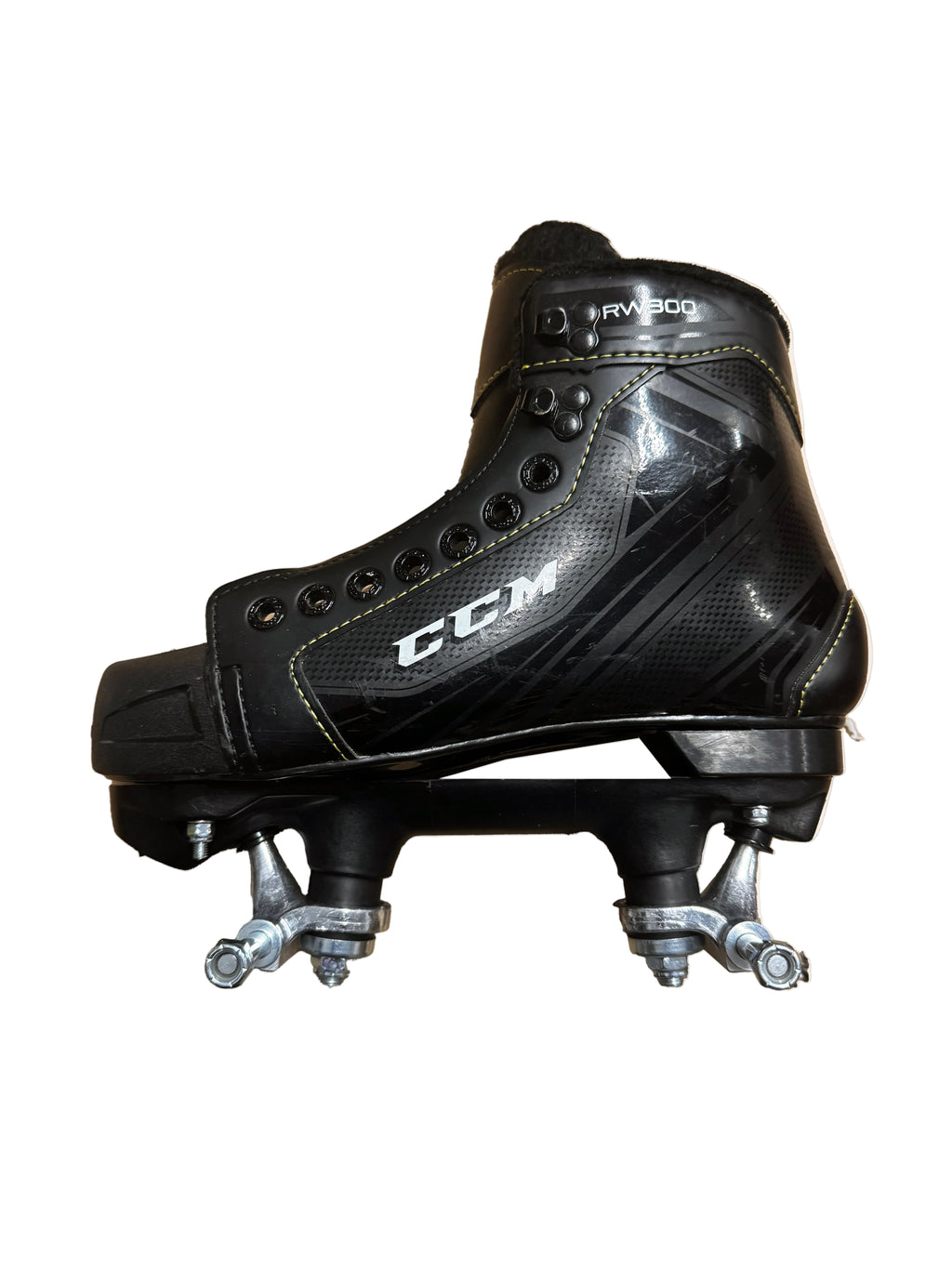 Black hockey skate with visible branding on a beige background